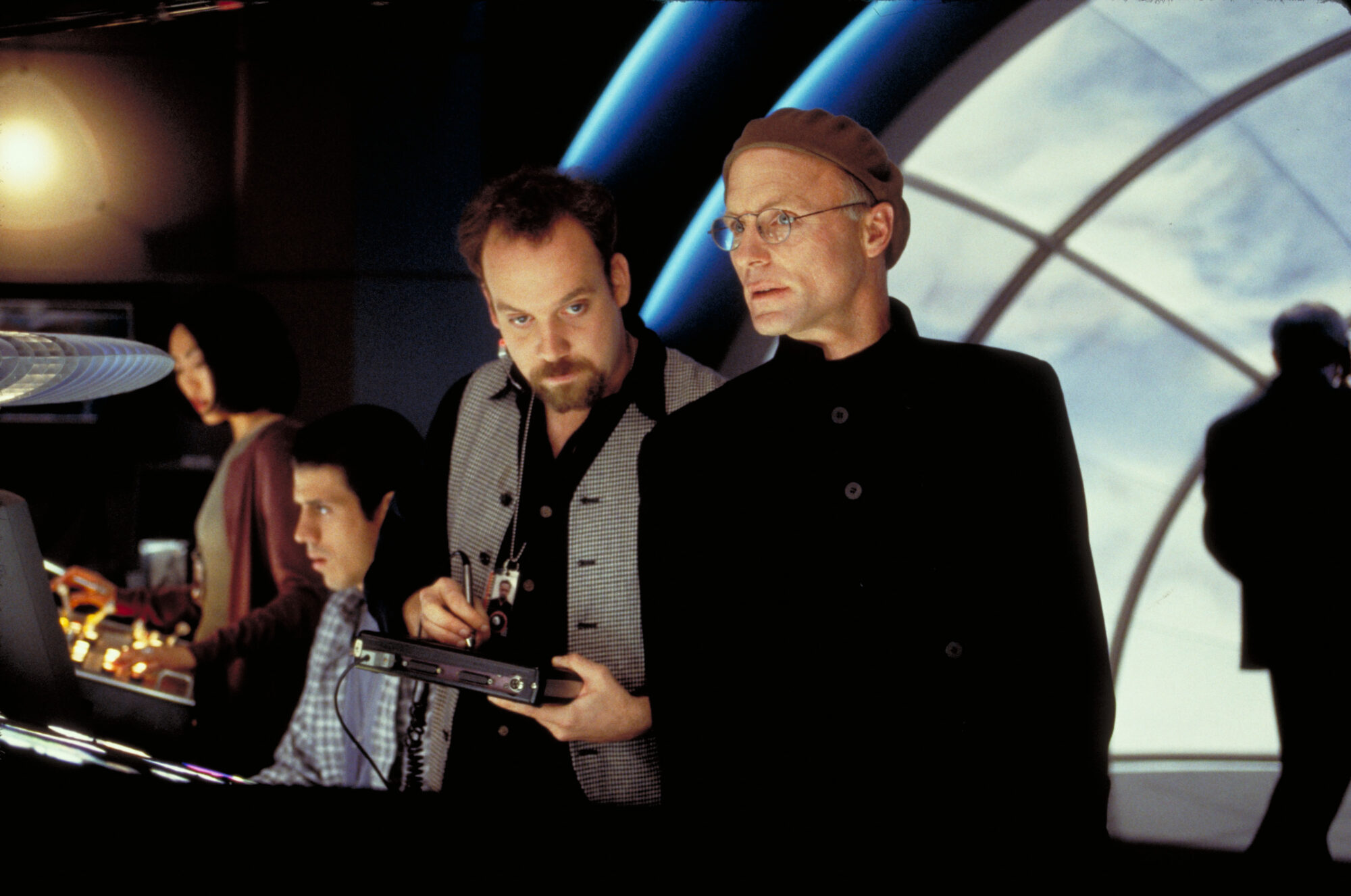 Christof and the production team watching Truman from the control room