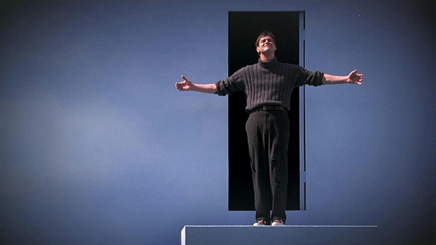 Truman standing at the doorway out of the painted sky